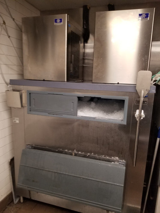 Manitowoc Nugget Style 1000 Pound Ice Maker x 2 with Remote Refrigeration x 2 and 1600 pound Follett Bin